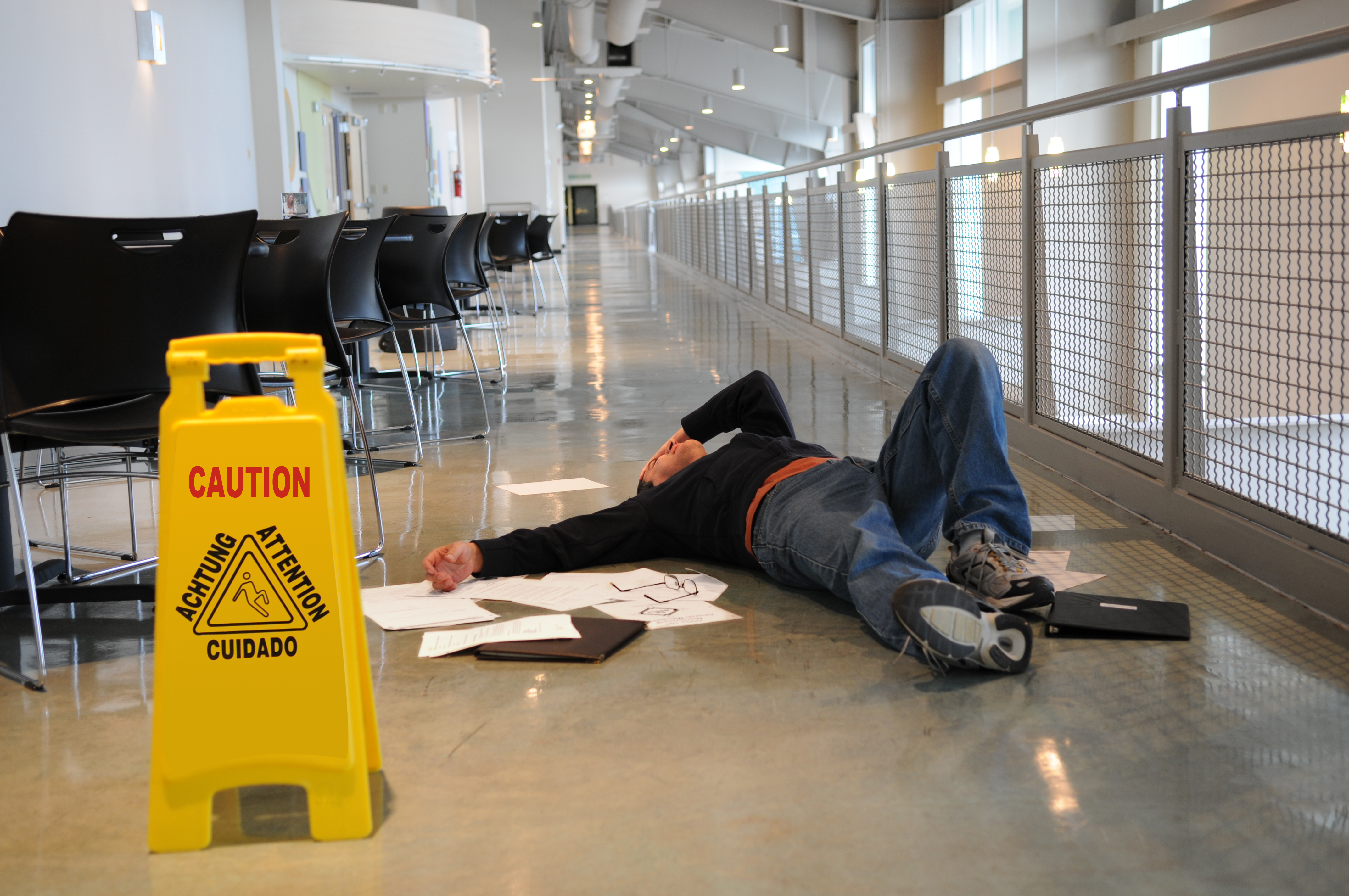 Man Lying on Slippery Floor